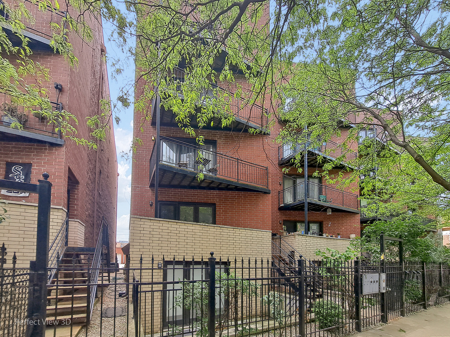 25 East 26th Street, Unit 4 Chicago, IL 60616 - Photo 1 of 24 front view of a house with a tree