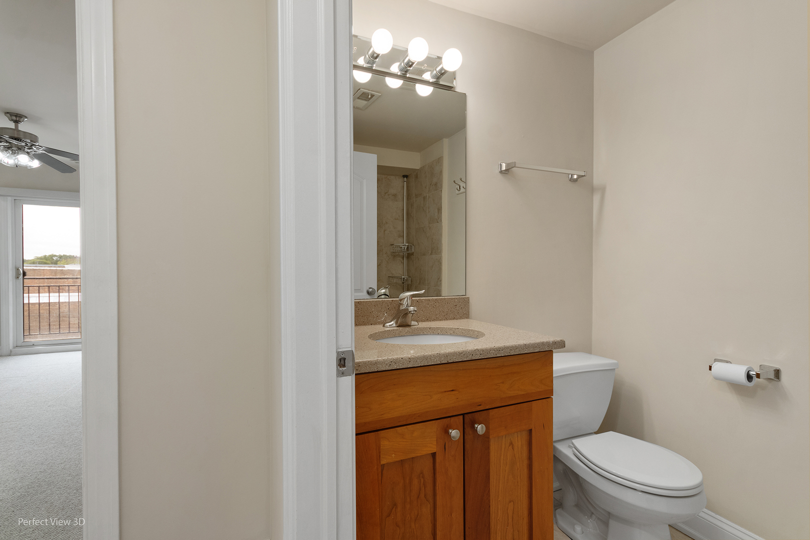 25 East 26th Street, Unit 4 Chicago, IL 60616 - Photo 19 of 24 a bathroom with a granite countertop toilet sink and mirror