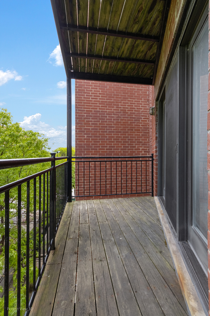 25 East 26th Street, Unit 4 Chicago, IL 60616 - Photo 21 of 24 a view of a balcony with wooden floor
