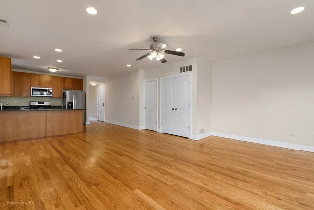 a view of a kitchen with microwave and cabinets