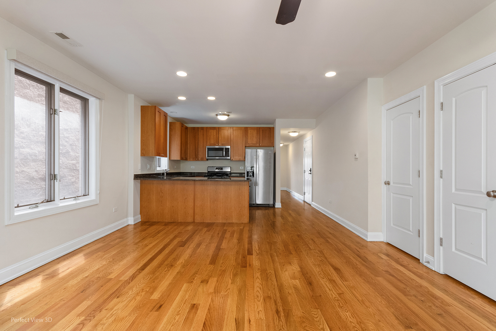 25 East 26th Street, Unit 4 Chicago, IL 60616 - Photo 7 of 24 a view of kitchen with wooden floor and electronic appliances
