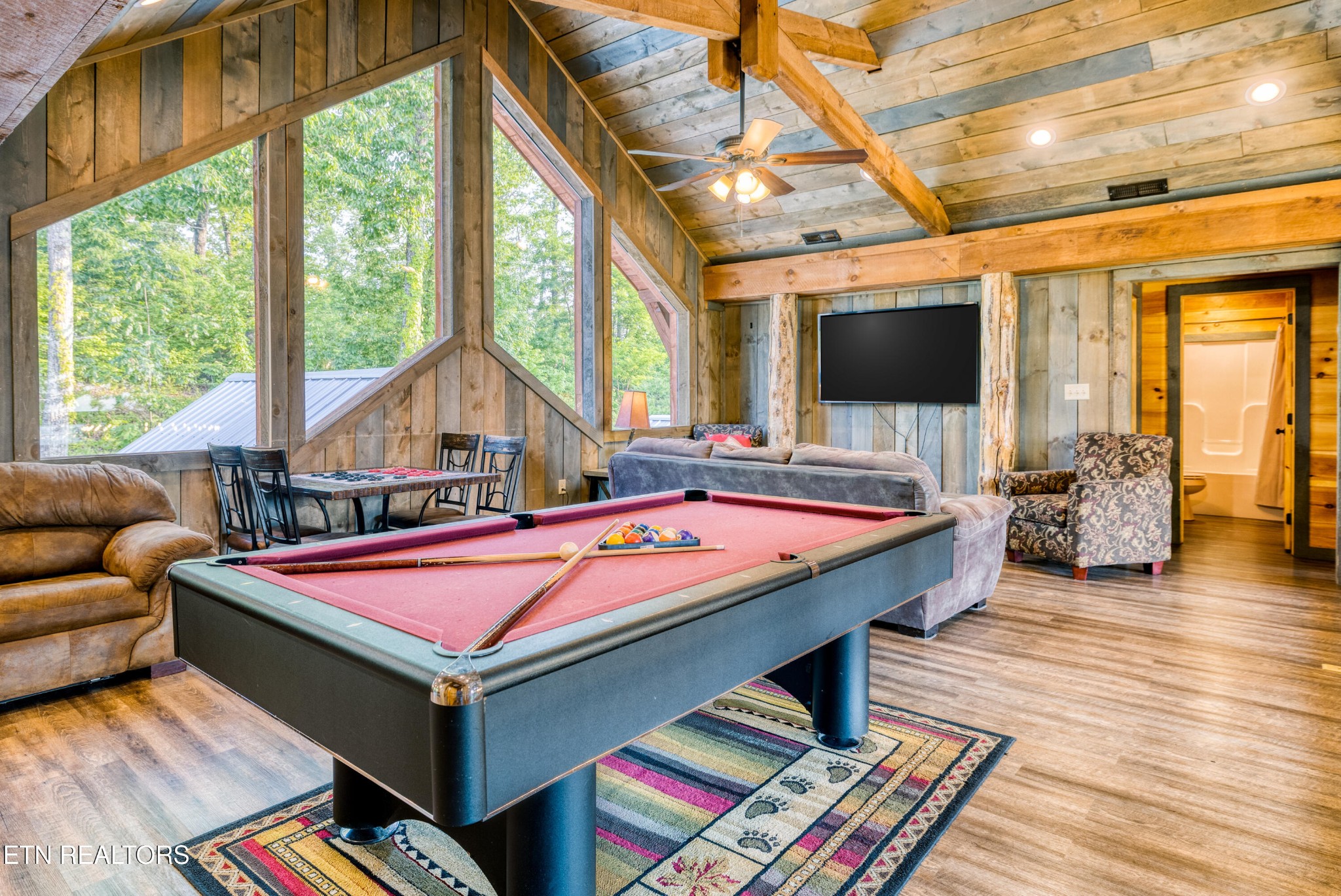 809 Pinecrest Way Sevierville, TN 37862 - Photo 33 of 60 a room with furniture pool table wooden floor and windows