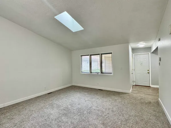 a kitchen with stainless steel appliances granite countertop a stove sink microwave and refrigerator