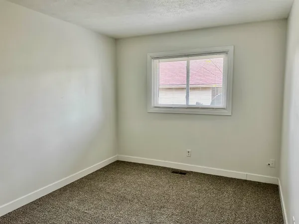 an empty room with a bench