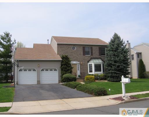 77 Princess Drive North Brunswick, NJ 08902 - Photo 1 of 7 front view of a house with a yard
