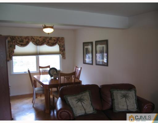 77 Princess Drive North Brunswick, NJ 08902 - Photo 4 of 7 a view of a dining room with furniture and window