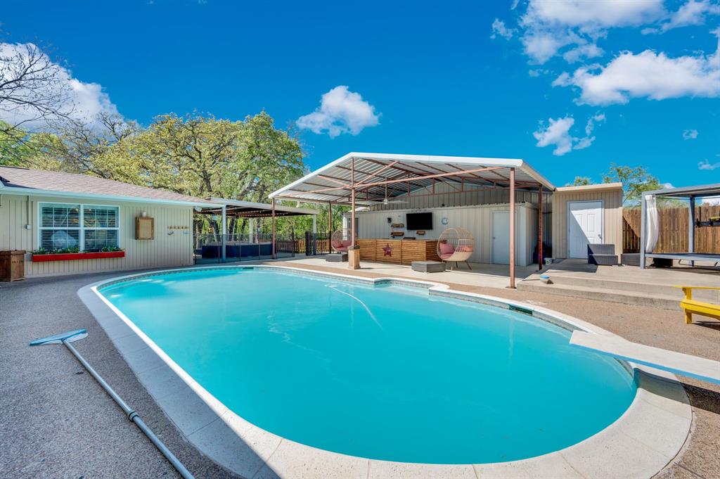 2263 Old Dicey Road Weatherford, TX 76085 - Photo 21 of 40 a view of a house with swimming pool and porch