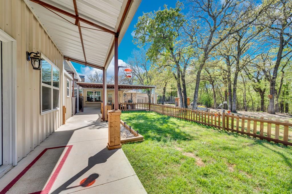 2263 Old Dicey Road Weatherford, TX 76085 - Photo 26 of 40 a view of a backyard with a garden