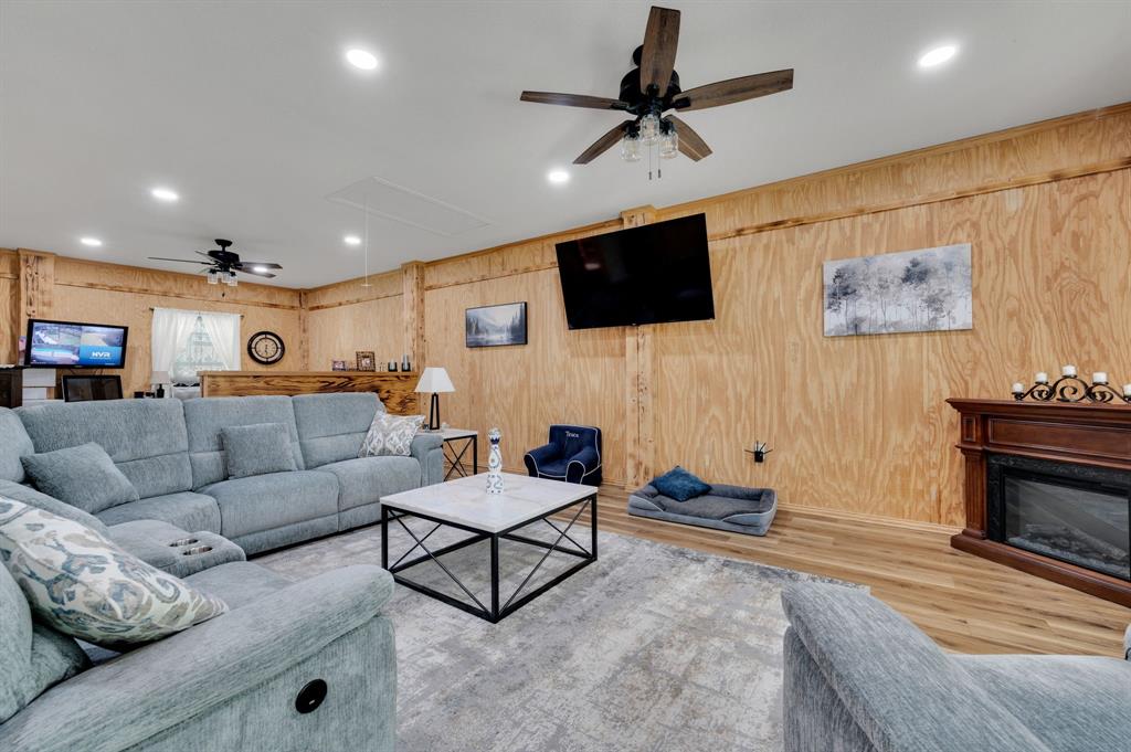 2263 Old Dicey Road Weatherford, TX 76085 - Photo 30 of 40 a living room with furniture and a flat screen tv