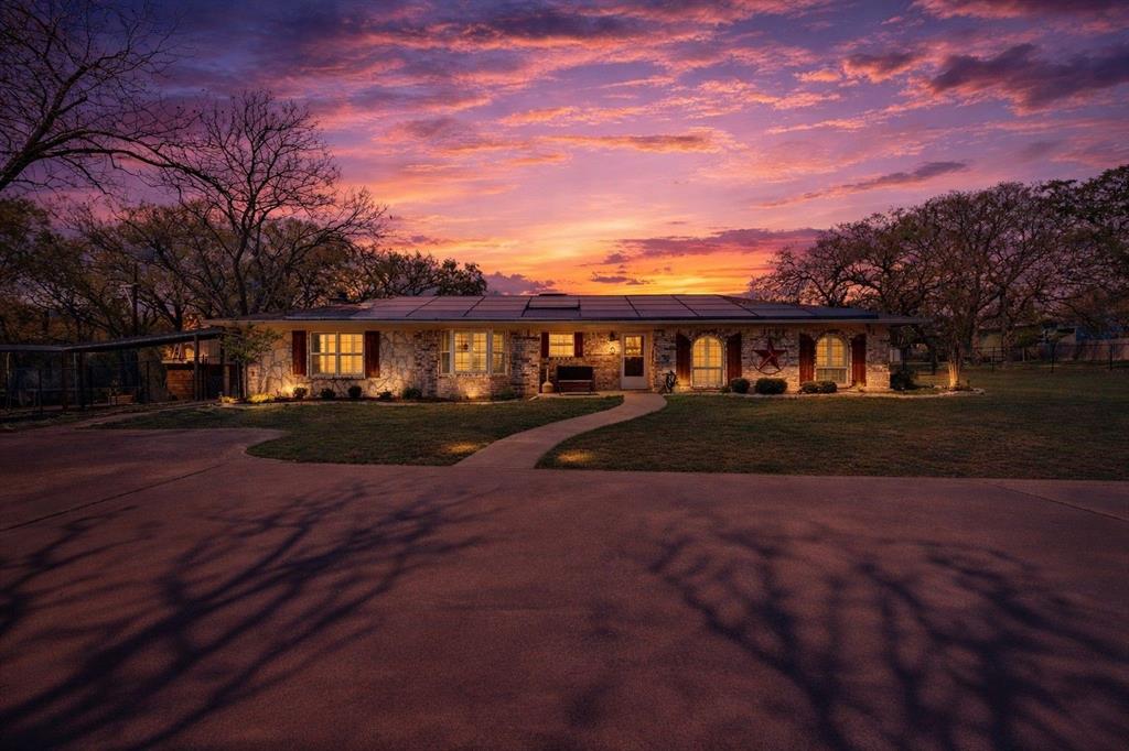 2263 Old Dicey Road Weatherford, TX 76085 - Photo 3 of 40 a view of house with yard and trees in the background