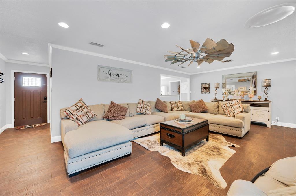 2263 Old Dicey Road Weatherford, TX 76085 - Photo 5 of 40 a living room with furniture and a chandelier