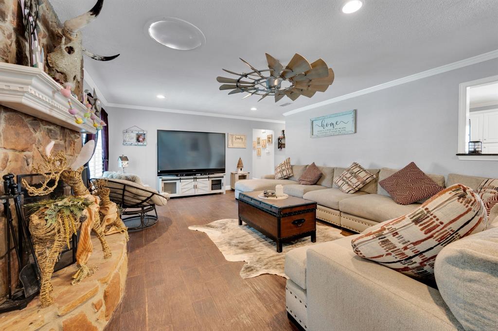2263 Old Dicey Road Weatherford, TX 76085 - Photo 10 of 40 a living room with furniture and a flat screen tv
