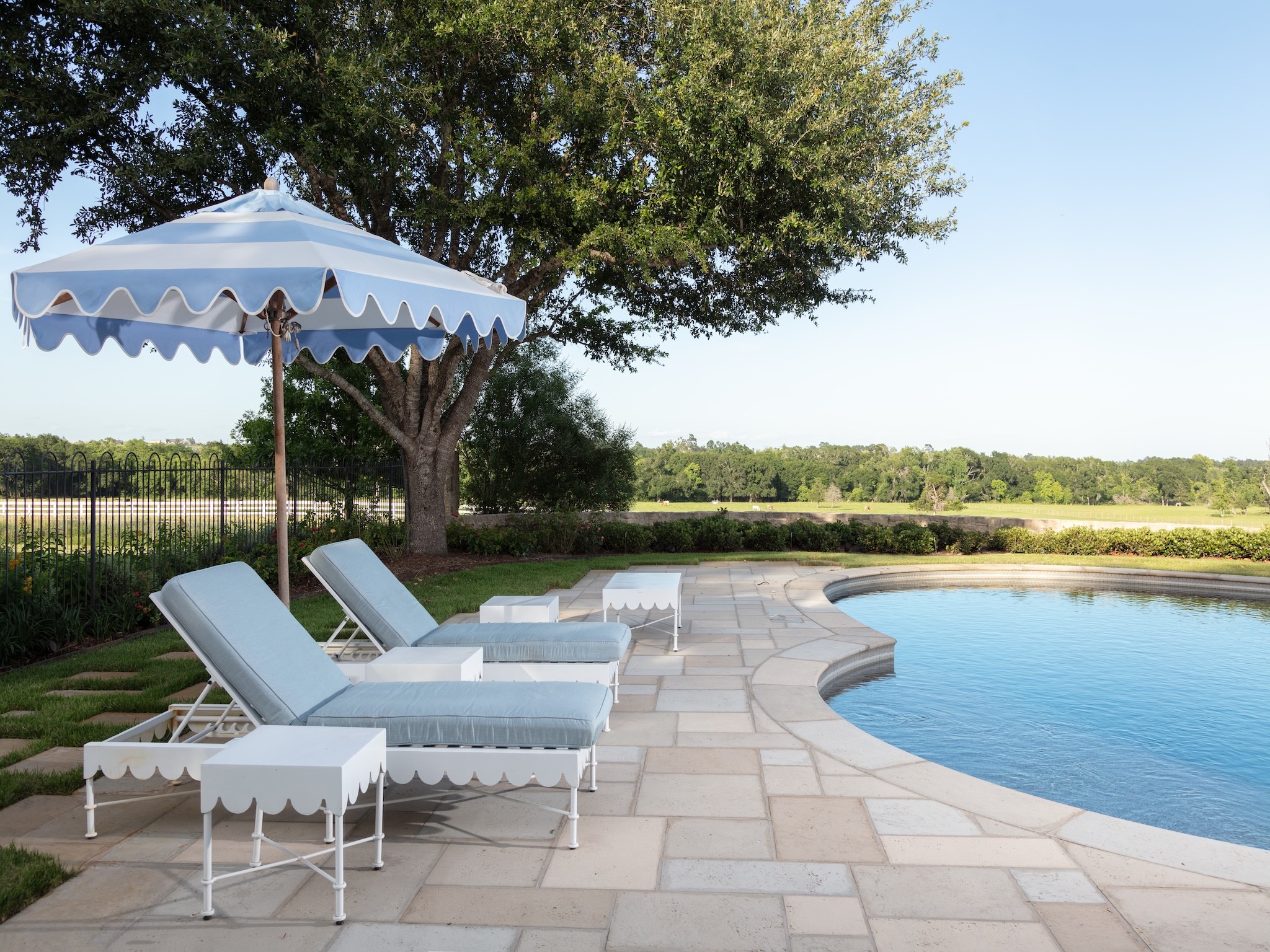2228 Center Hill Road Bellville, TX 77418 - Photo 20 of 50 a view of a patio with a table chairs and a lake view
