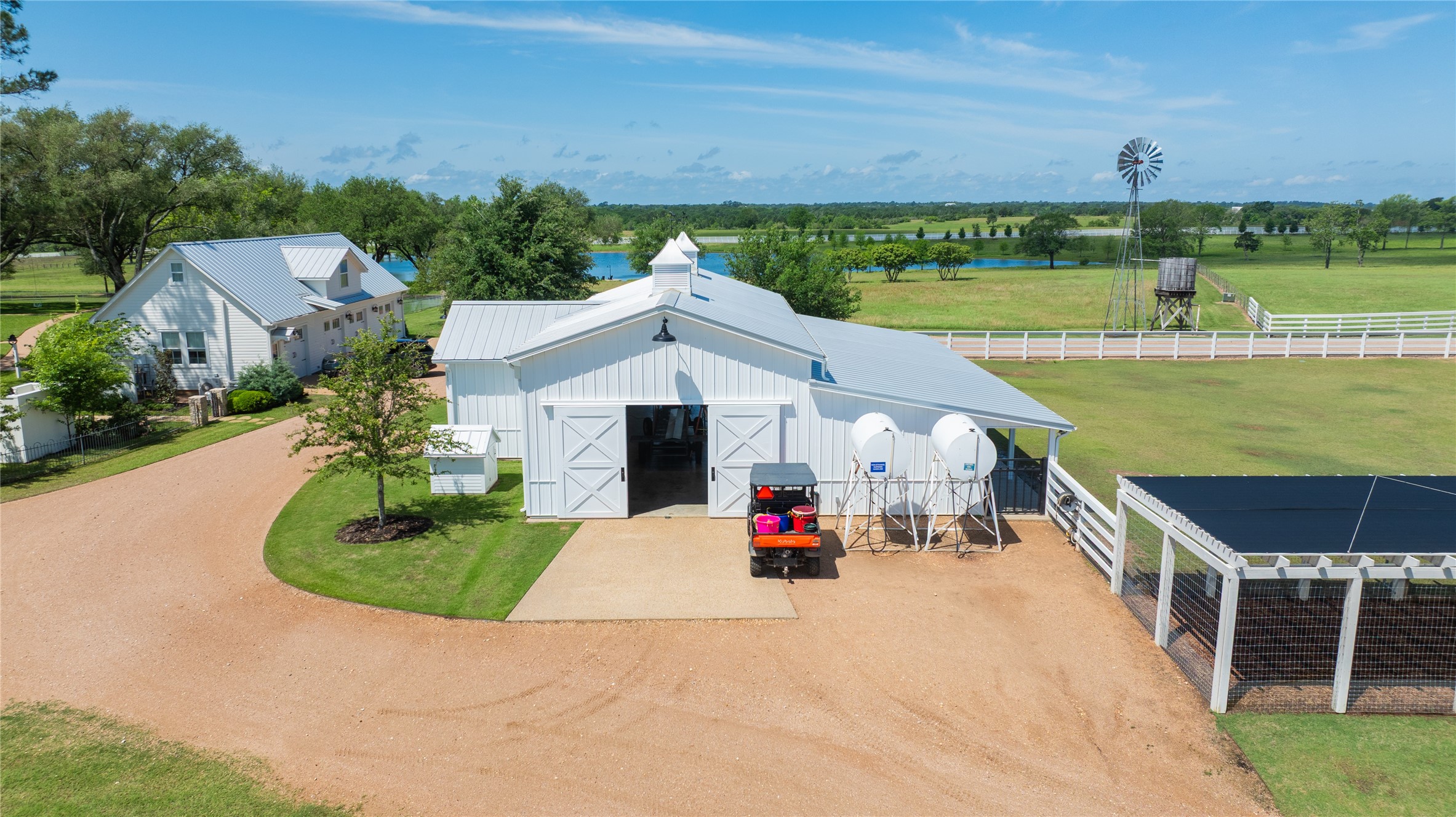 2228 Center Hill Road Bellville, TX 77418 - Photo 42 of 50 Alternate view of pole bar 'a' with the garage to the left and fenced paddock to the right.
