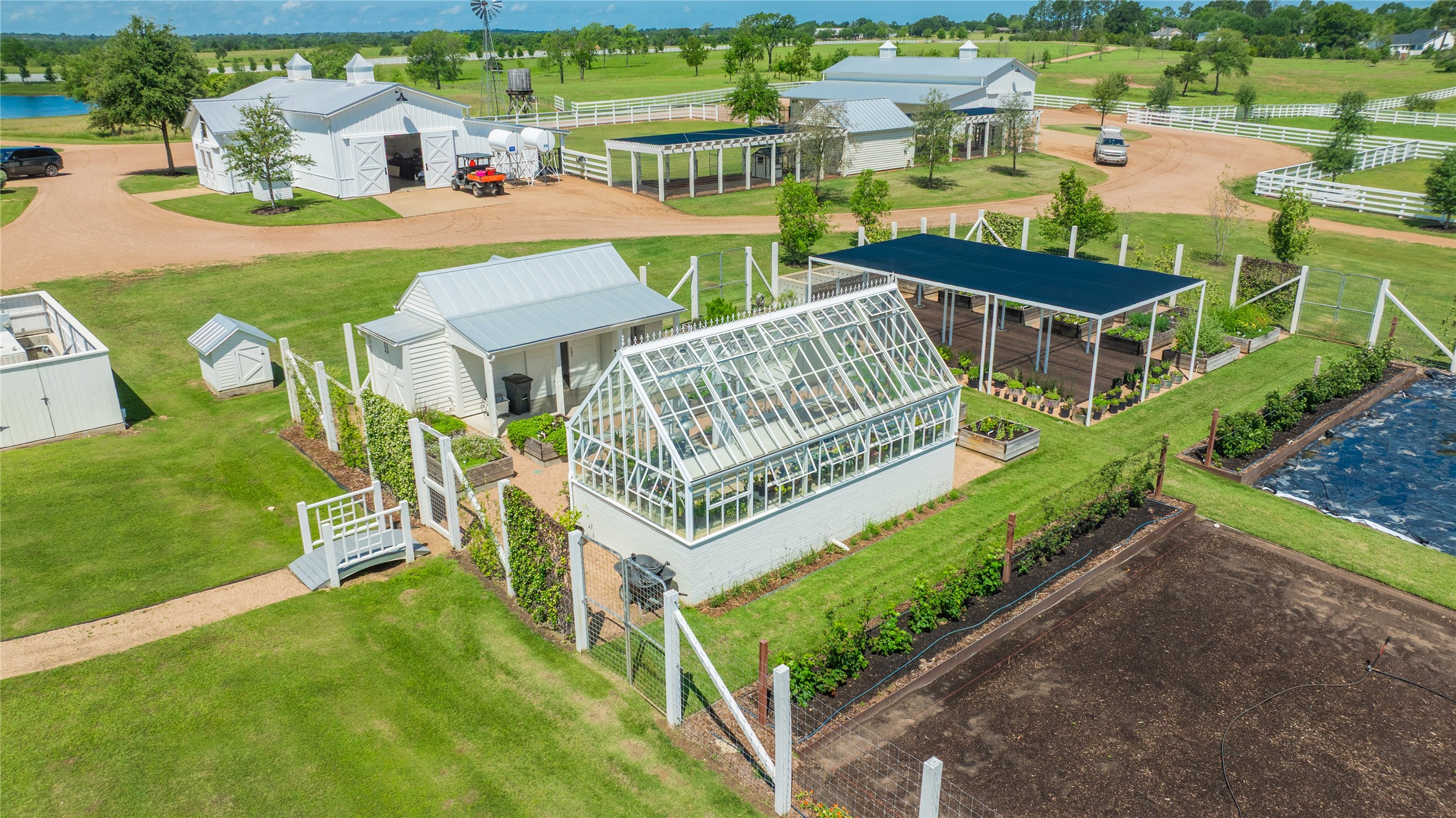 2228 Center Hill Road Bellville, TX 77418 - Photo 43 of 50 Garden shed and greenhouse within walking distance of the pole barns, main house, guest house, and garage, overlooking grazing pastures.