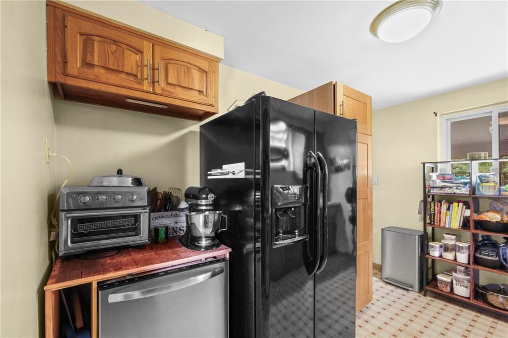 1654 Hollyrood Road Pittsburgh, PA 15227 - Photo 22 of 33 a kitchen view of a stove and a refrigerator