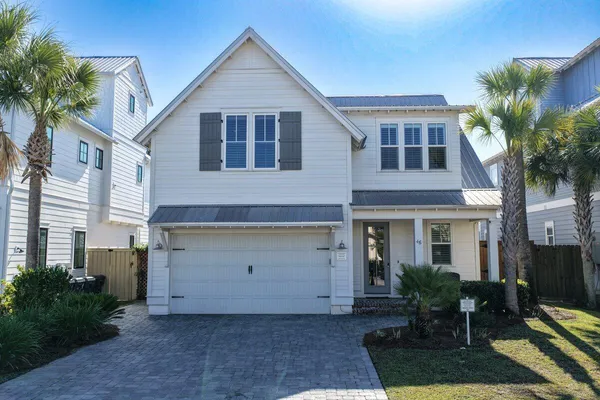 a front view of house with yard and seating space