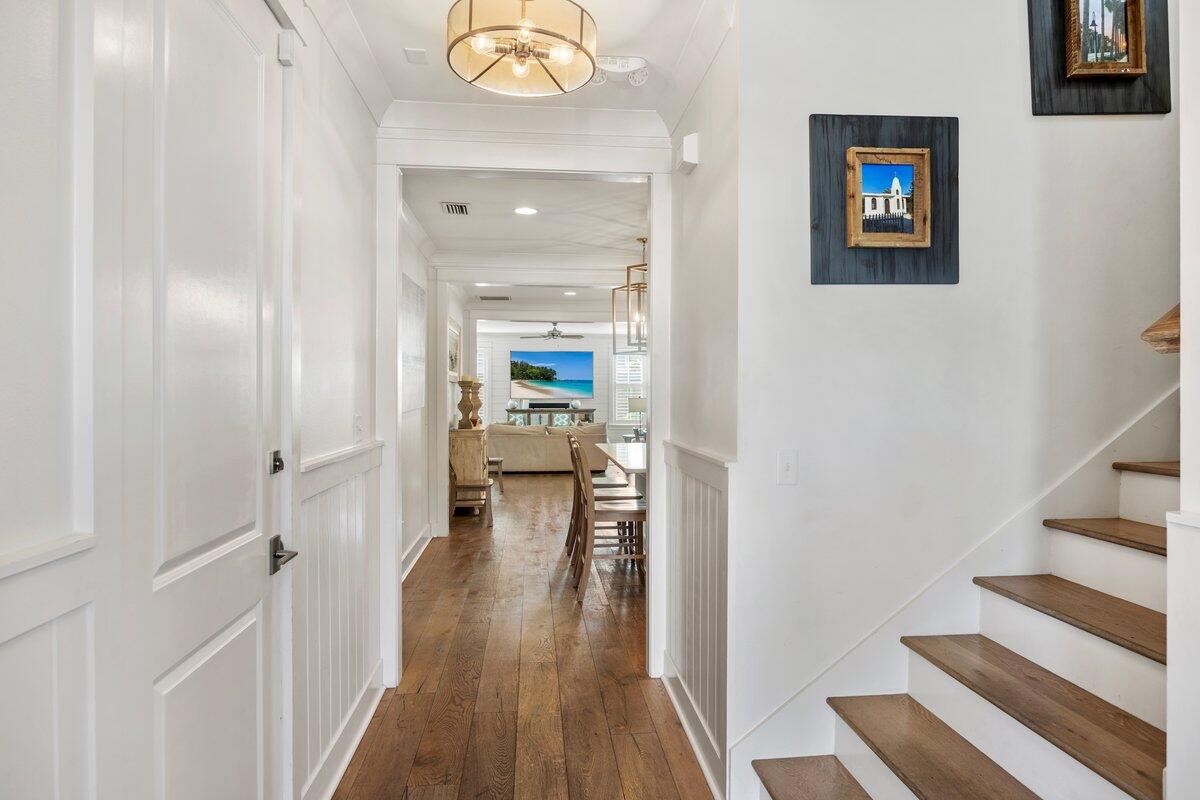 46 Lake Street Miramar Beach, FL 32550 - Photo 19 of 56 a view of a hallway with wooden floor and staircase