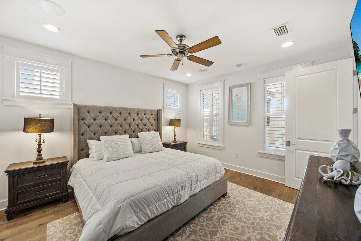 46 Lake Street Miramar Beach, FL 32550 - Photo 22 of 56 a bedroom with a bed and wooden floor