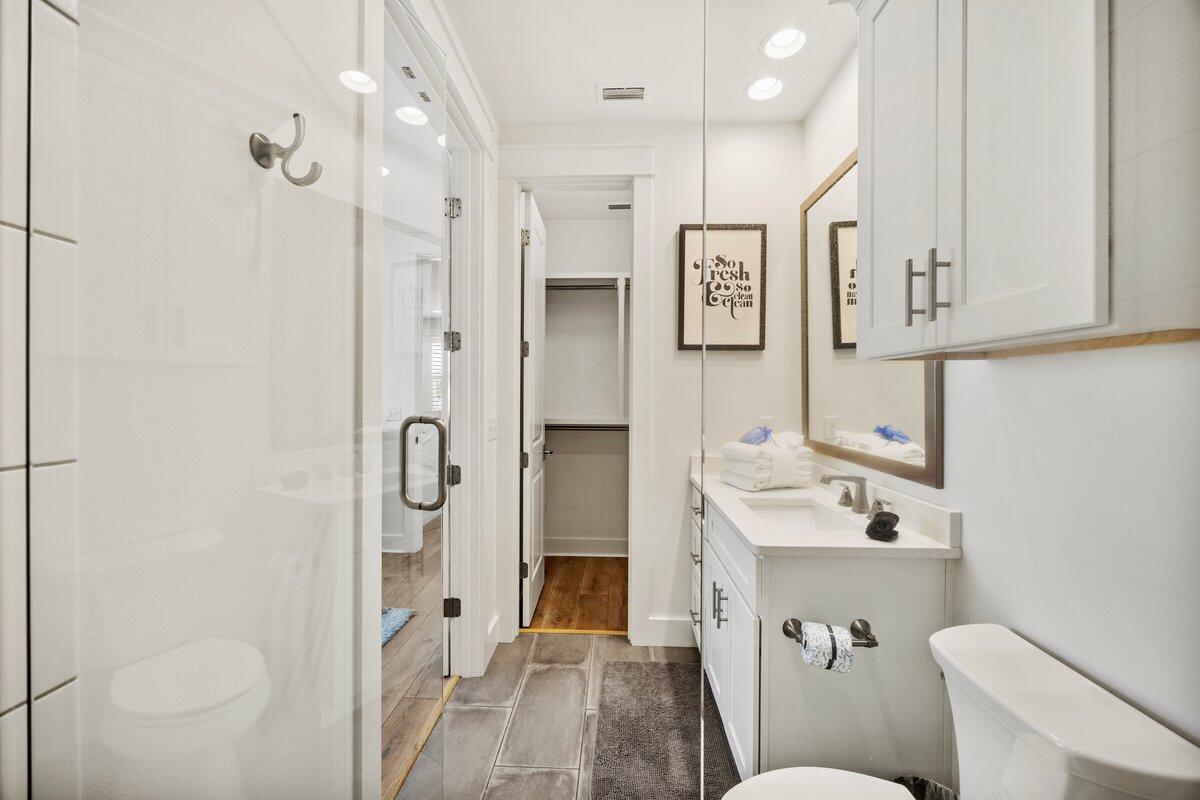 46 Lake Street Miramar Beach, FL 32550 - Photo 40 of 56 a bathroom with a sink a toilet a mirror and shower