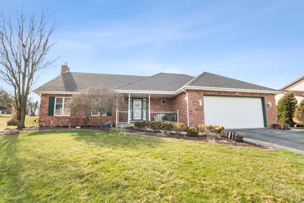 a view of a house with swimming pool and sitting area
