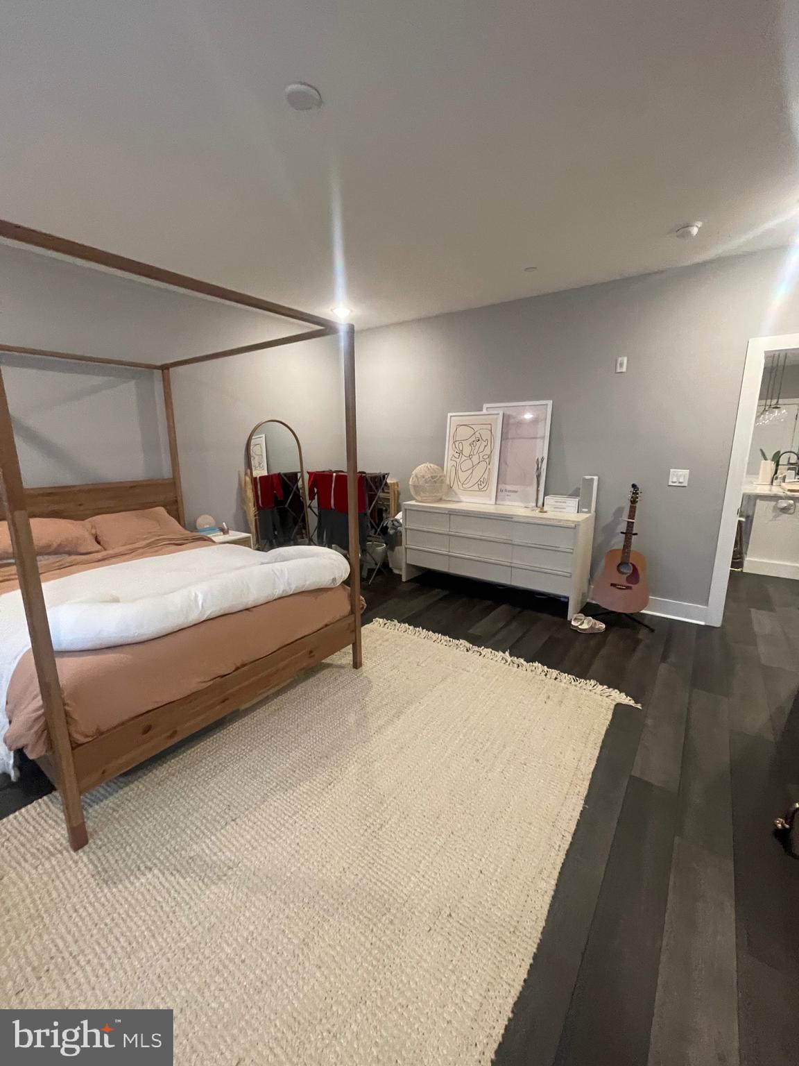 4007 Ridge Avenue Philadelphia, PA 19129 - Photo 10 of 14 a bedroom with a bed and wooden floor