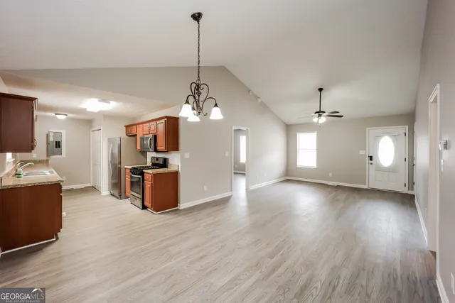 a view of a kitchen with furniture and a chandelier