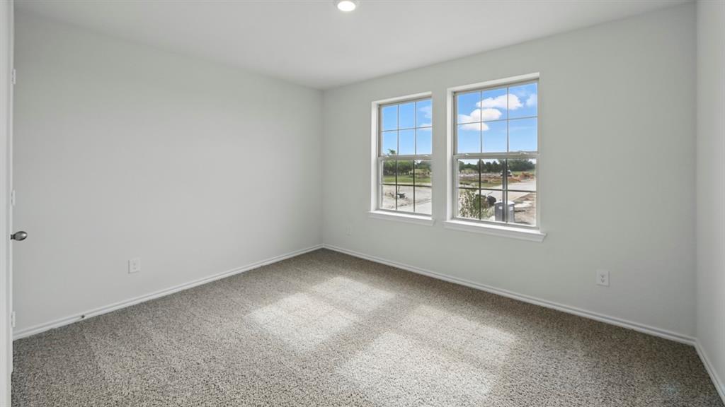 1608 Basalt Lane Celina, TX 75009 - Photo 14 of 36 an empty room with windows