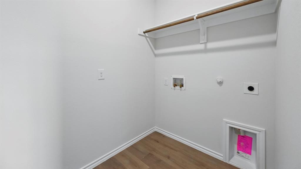 1608 Basalt Lane Celina, TX 75009 - Photo 30 of 36 a view of small space with racks on the wall