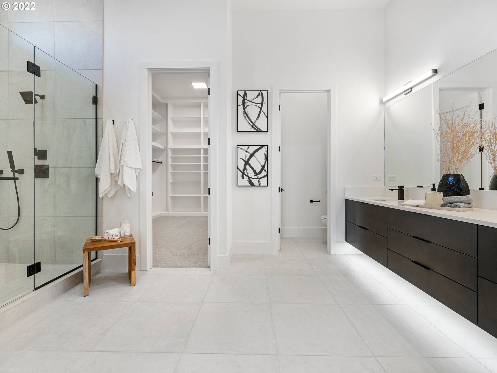 4713 Southeast Ascension Drive Camas, WA 98607 - Photo 16 of 32 a spacious bathroom with a double sink shower and a mirror