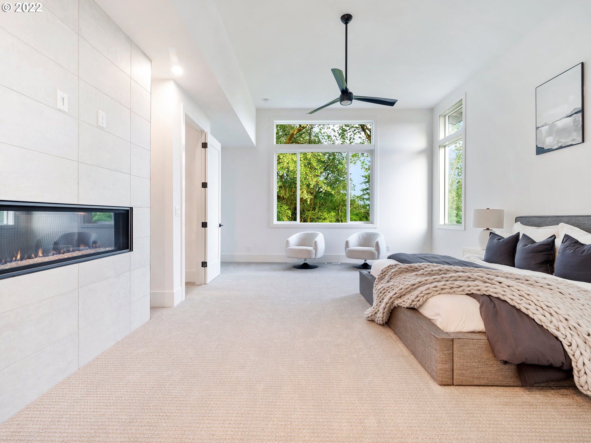 4713 Southeast Ascension Drive Camas, WA 98607 - Photo 20 of 32 a spacious bedroom with a bed and a chandelier