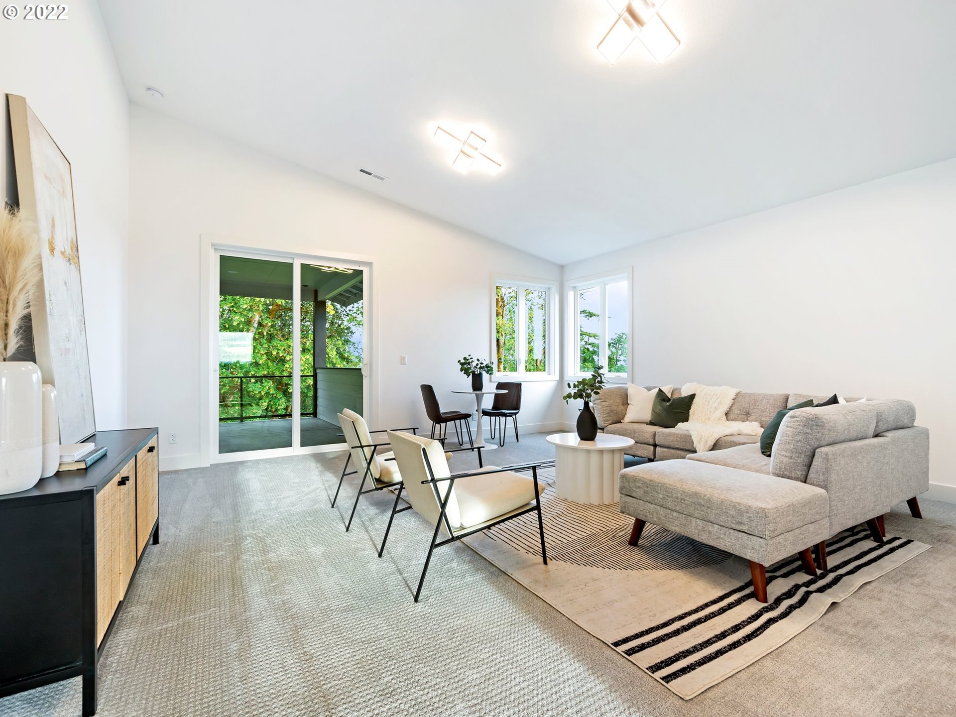 4713 Southeast Ascension Drive Camas, WA 98607 - Photo 23 of 32 a living room with furniture and a large window