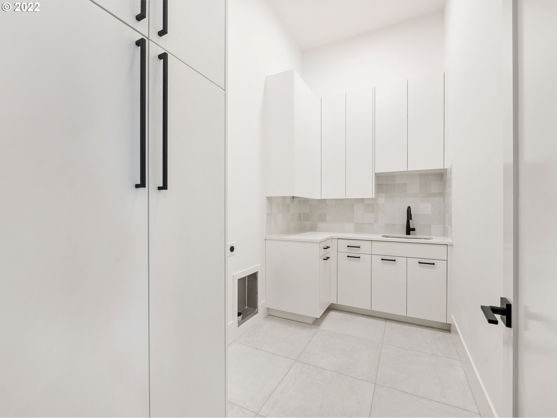 4713 Southeast Ascension Drive Camas, WA 98607 - Photo 32 of 32 a kitchen with white cabinets and white appliances