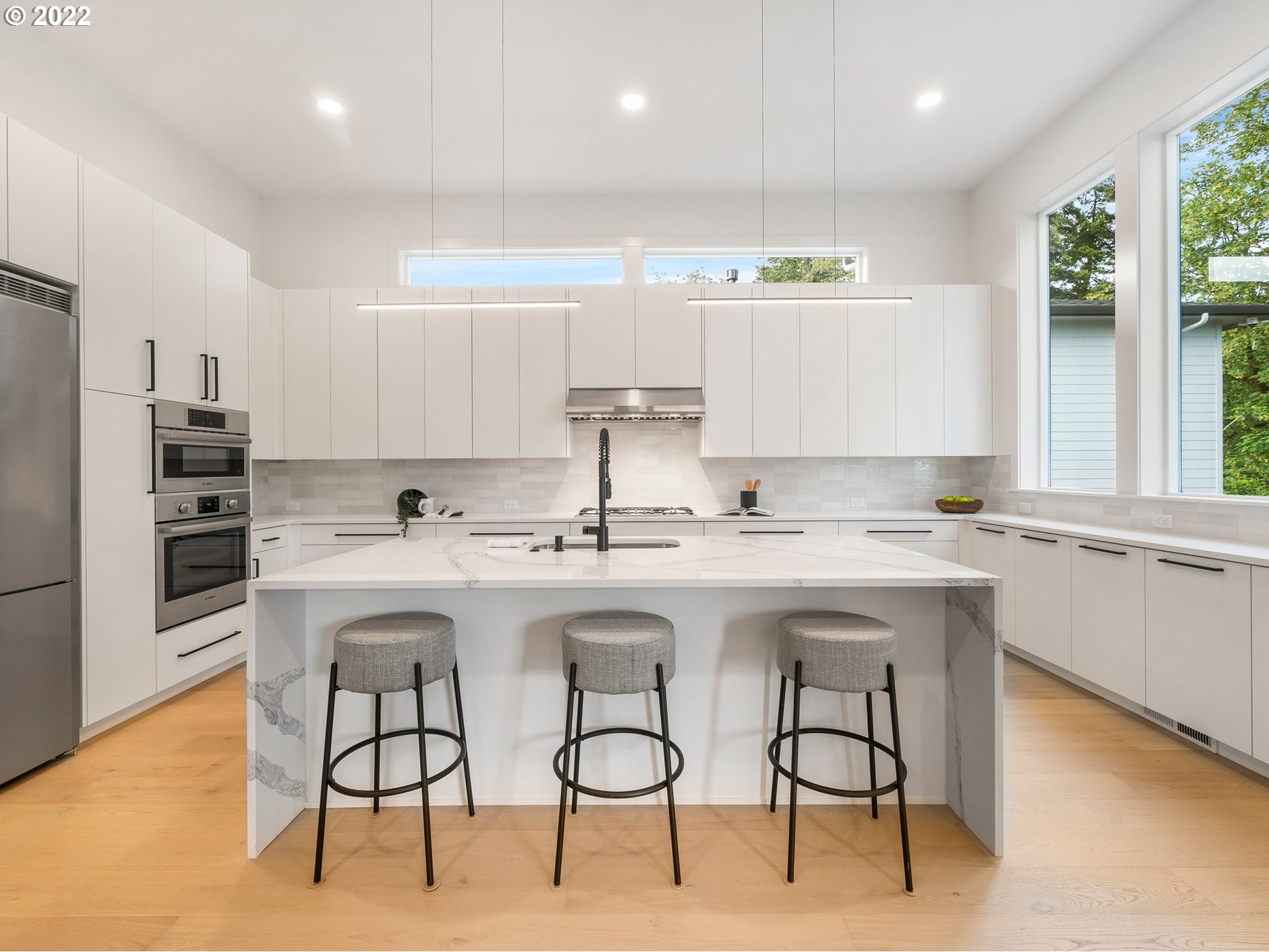4713 Southeast Ascension Drive Camas, WA 98607 - Photo 7 of 32 a kitchen with stainless steel appliances granite countertop a sink and a refrigerator