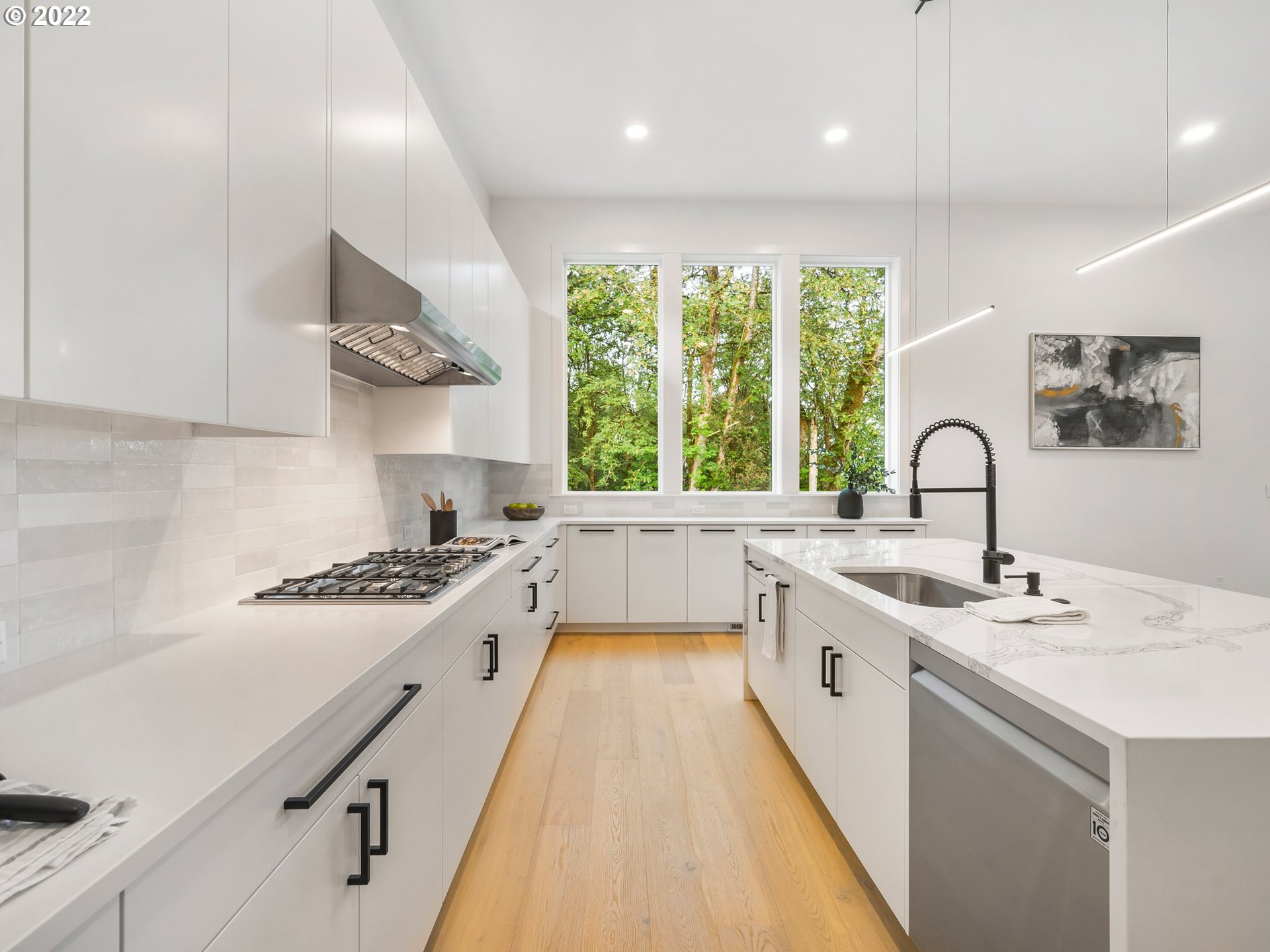 4713 Southeast Ascension Drive Camas, WA 98607 - Photo 9 of 32 a kitchen with a sink a stove and cabinets