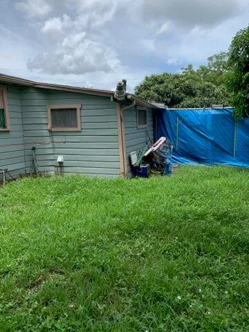 a view of a back yard of the house