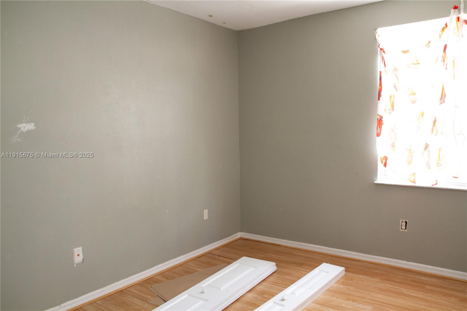 761 Southeast 2nd Street, Unit 761 Homestead, FL 33030 - Photo 6 of 12 a view of an empty room and window