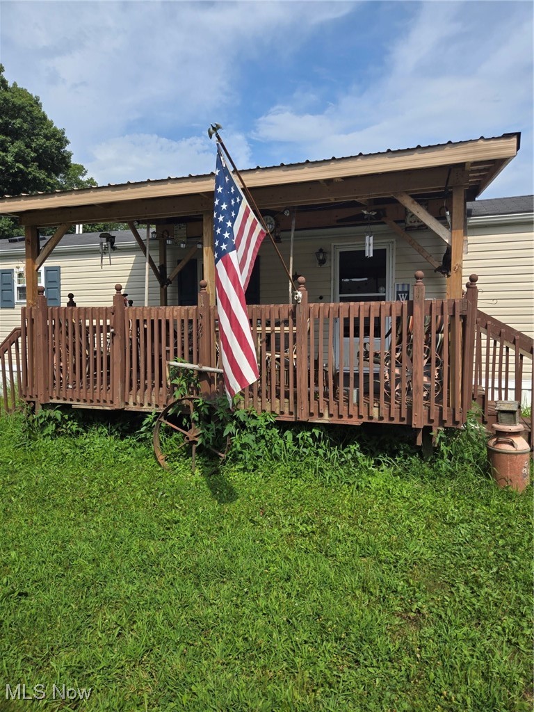 5974 Cleveland Road, Unit 23 Wooster, OH 44691 - Photo 2 of 29 Rear view of house with a deck and a yard