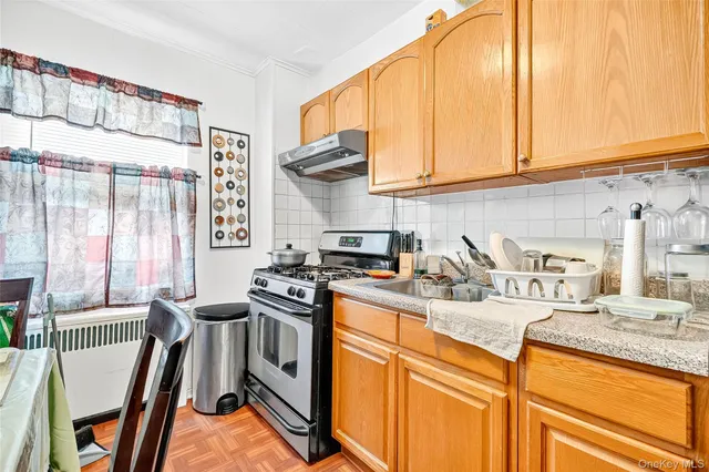 a very nice looking open dining room with a large kitchen view