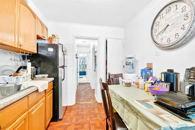 a bedroom with a bed and a mirror on the dresser
