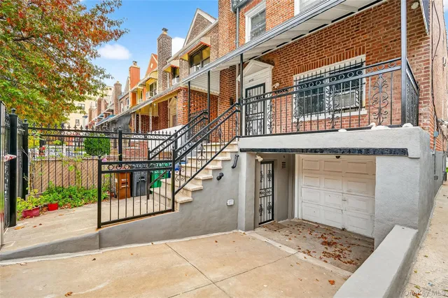 a view of a brick building with many windows