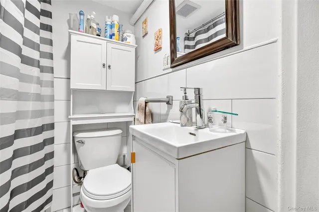 a view of a building with car parked