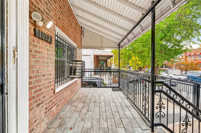 a view of balcony with wooden floor