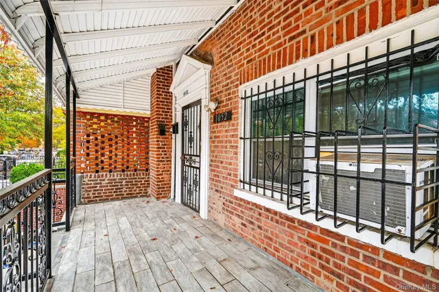 a balcony view with a glass door