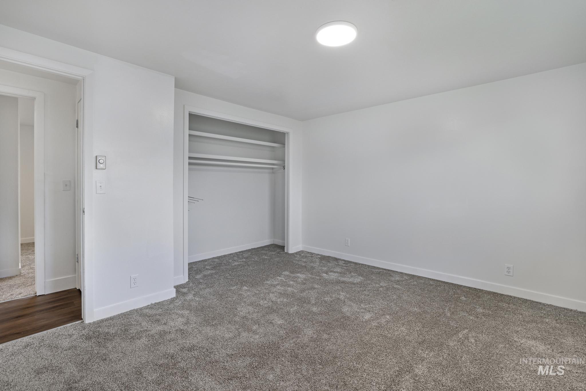 201 East 27th Street Burley, ID 83318 - Photo 7 of 19 Unfurnished bedroom with carpet floors and a closet