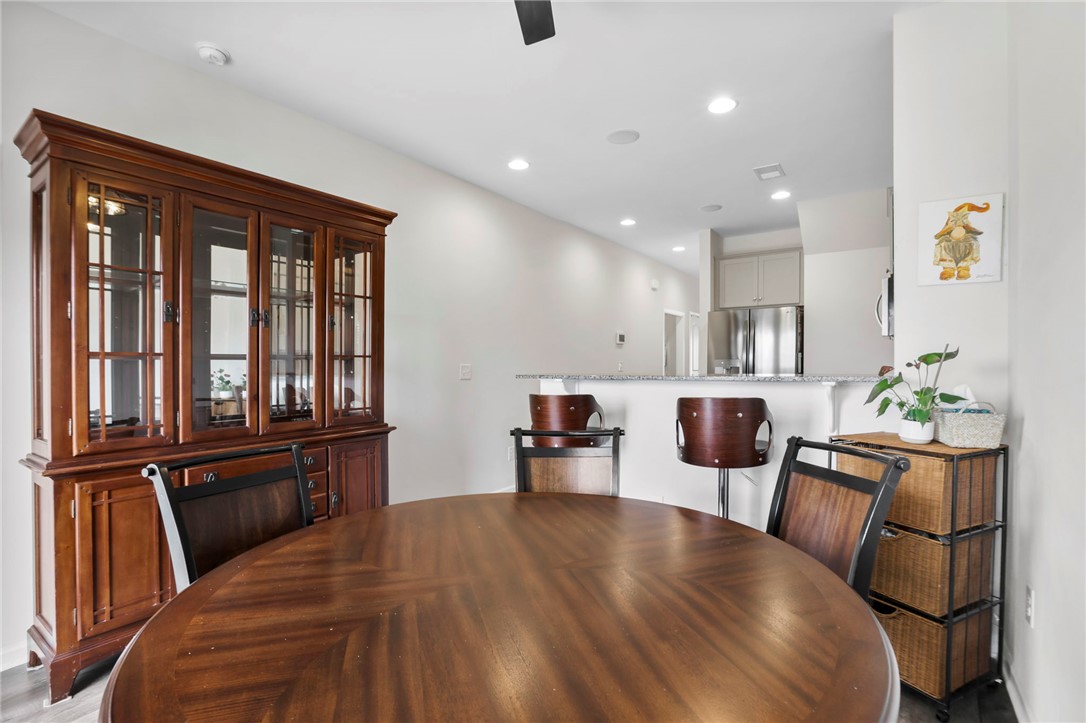 251 Samuel Street Pendleton, SC 29670 - Photo 12 of 37 This inviting dining area seamlessly connects to a modern kitchen, perfect for entertaining.