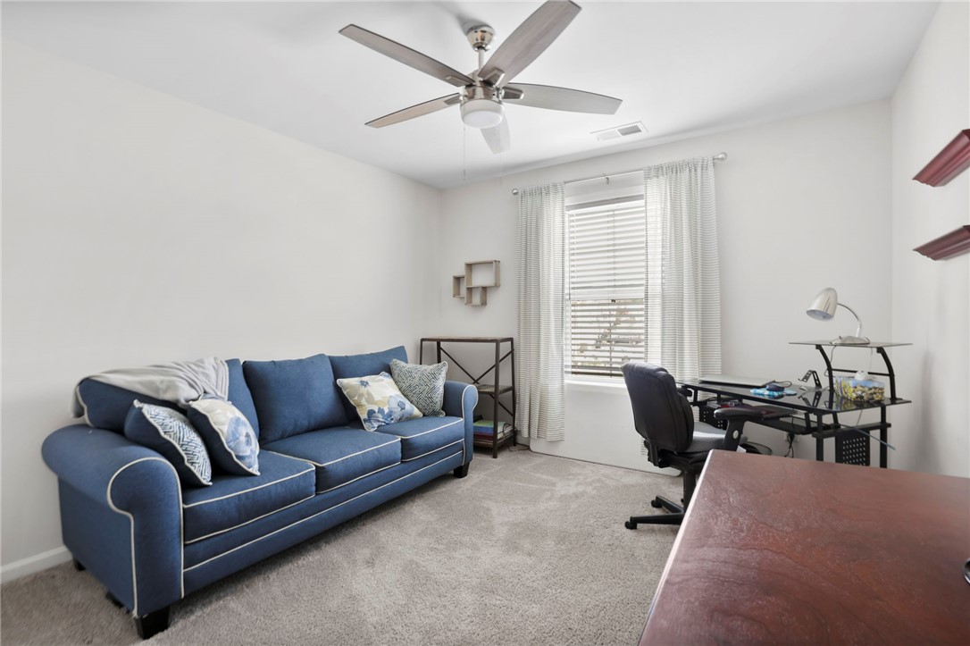 251 Samuel Street Pendleton, SC 29670 - Photo 21 of 37 This versatile room offers comfort and a dedicated workspace, ideal for productivity or relaxation.