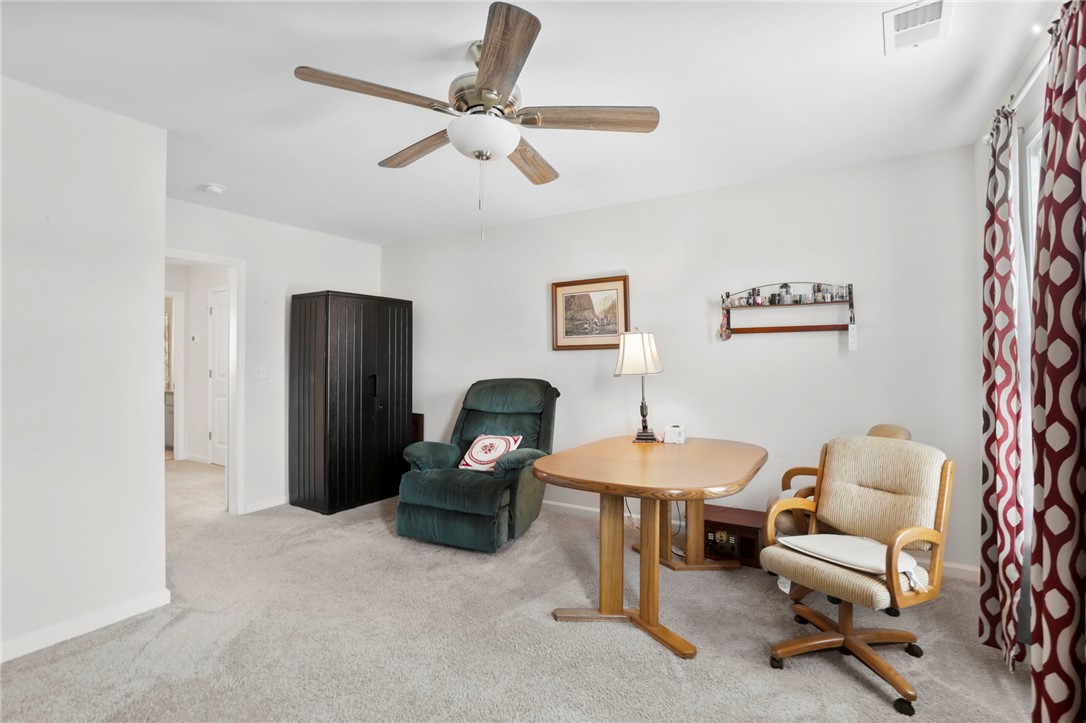 251 Samuel Street Pendleton, SC 29670 - Photo 24 of 37 This versatile room features comfortable carpeting, perfect for a home office or relaxation space.