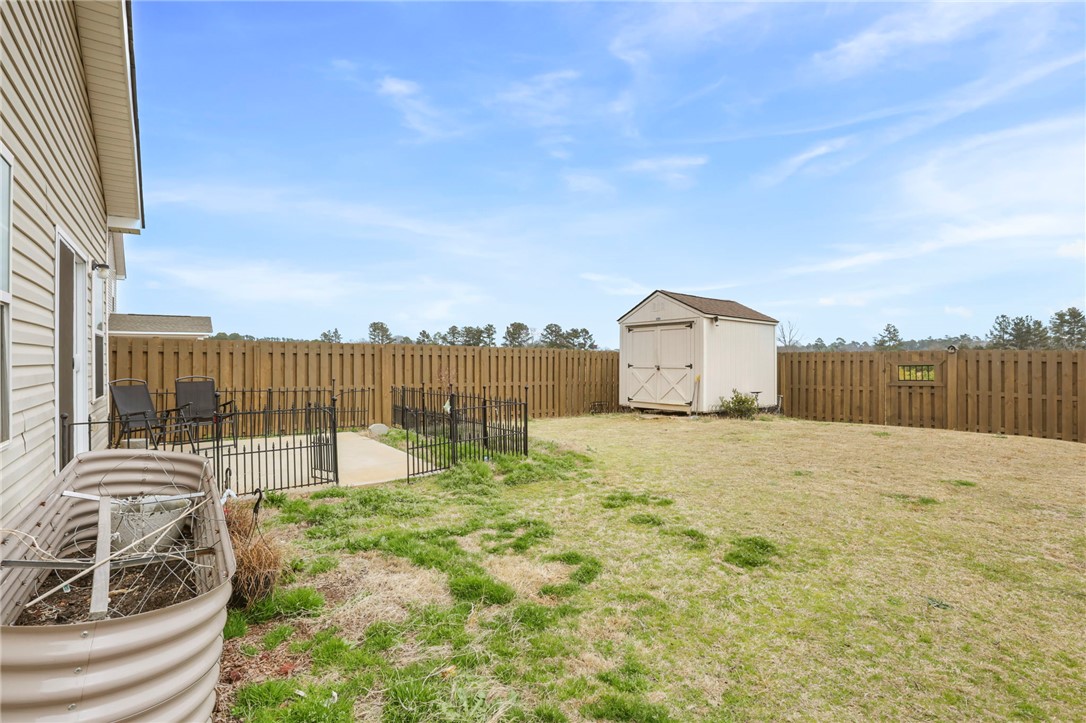 251 Samuel Street Pendleton, SC 29670 - Photo 26 of 37 This spacious backyard provides ample room for outdoor activities and relaxation.