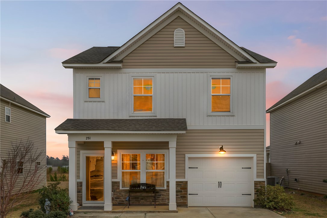 251 Samuel Street Pendleton, SC 29670 - Photo 31 of 37 This charming home features a welcoming porch and an attached garage, perfect for modern living.